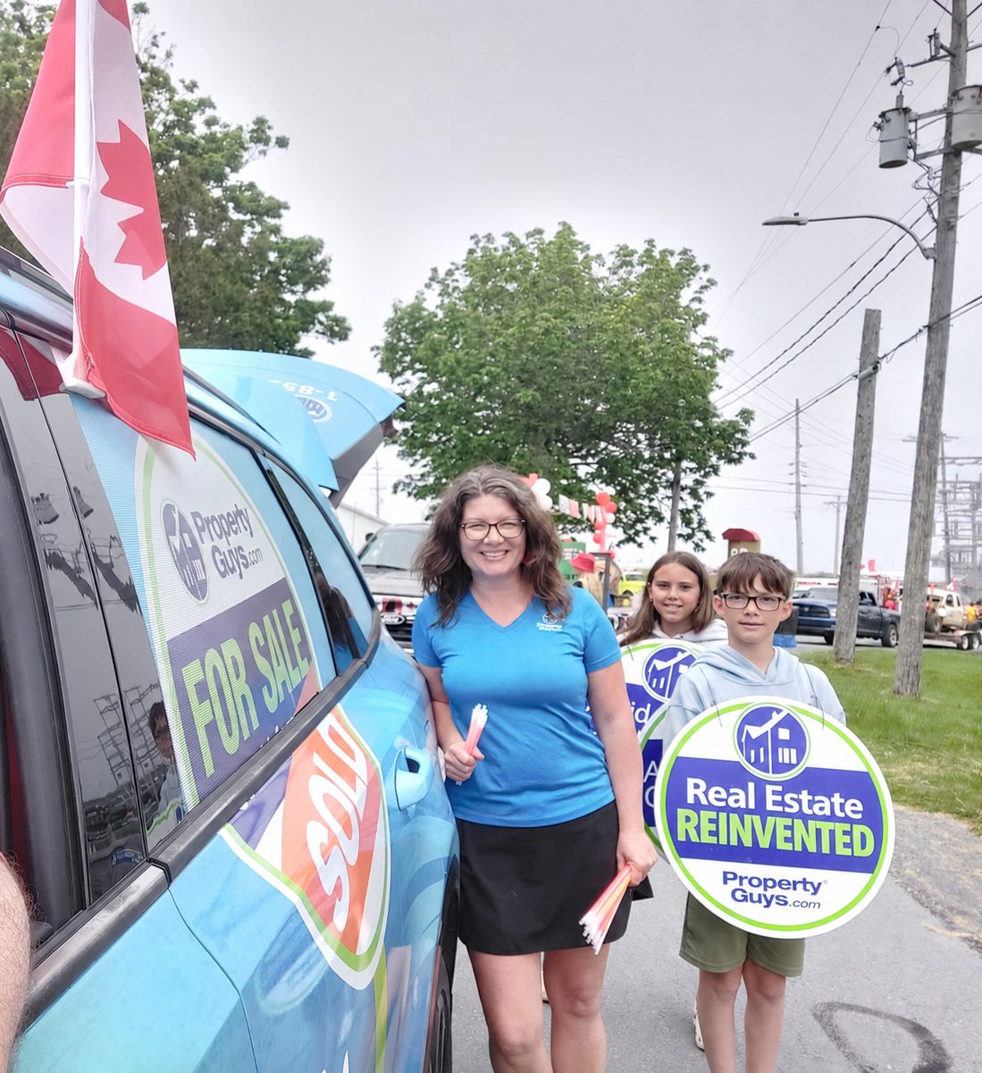PropertyGuys.com franchisee Mary-Ann at a Canada Day real estate parade