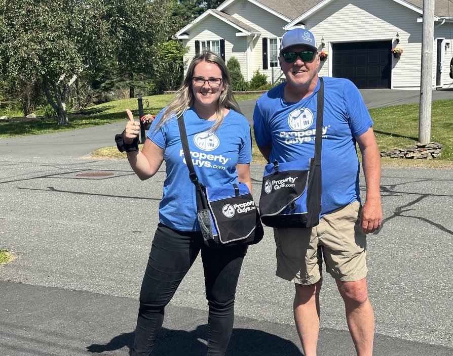 smaller franchise territories – PropertyGuys.com franchisees Becky and Mark door-knocking in Truro